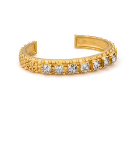 Fleur De Lis bangle features a row of Ochre Delite Euro Crystal by French Kande